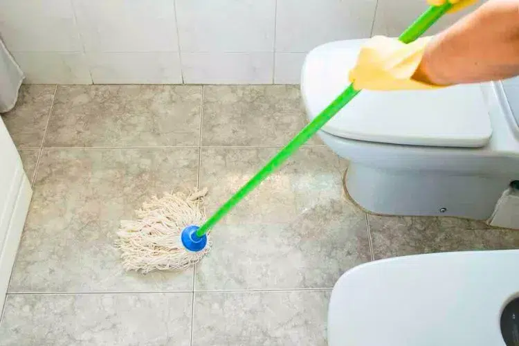 How do you clean the floor under a toilet