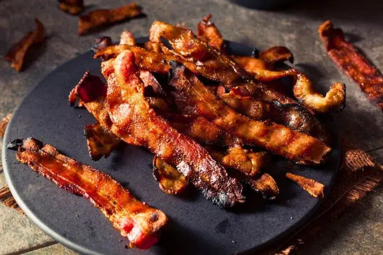 How long can cooked bacon sit out at room temperature