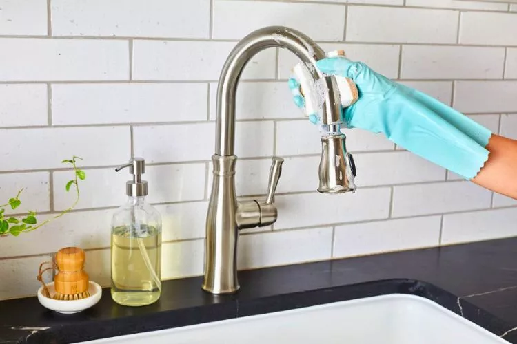 How do you clean the kitchen faucet head without vinegar