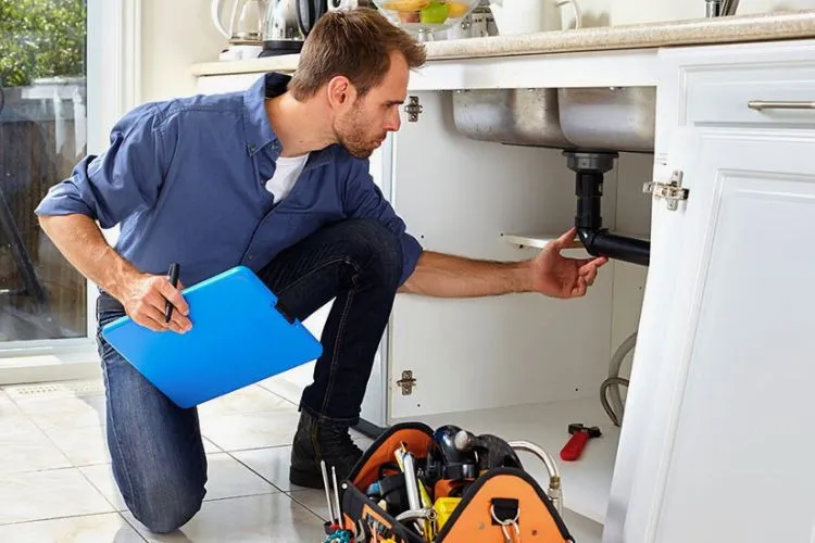 How often should I conduct maintenance checks under the sink