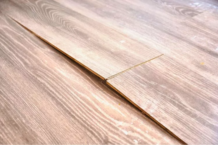 How do you stop vinyl flooring from lifting